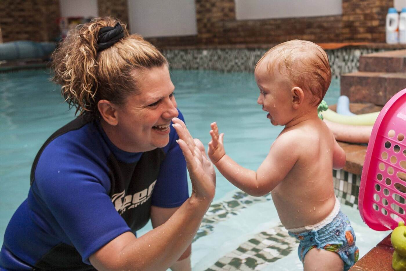 Happy young swimmer enjoying a Kiddies Aqua lesson