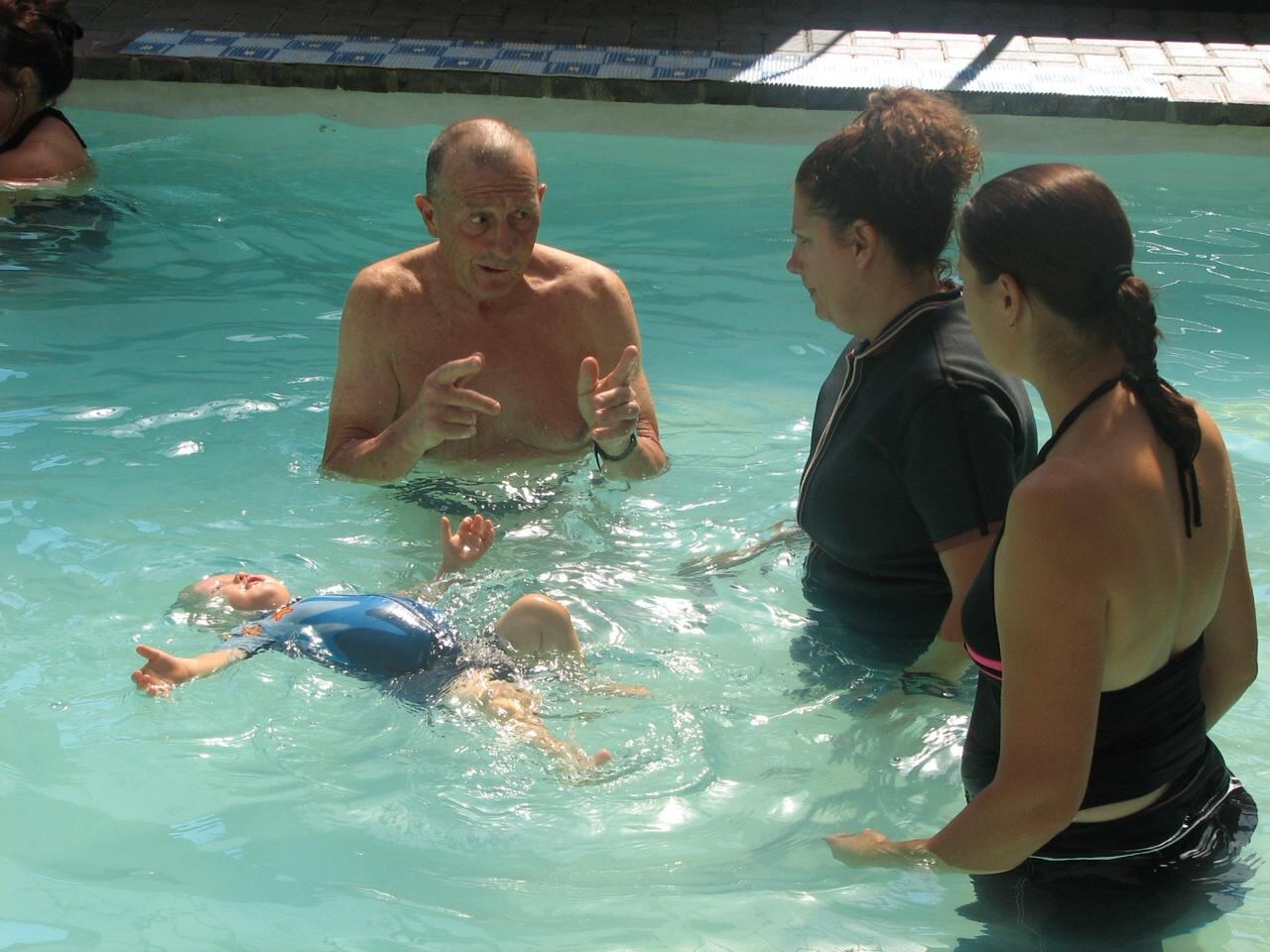 Jean Fouace and Lizette Botha on the pool deck of a Kiddies Aqua Swimming Academy branch in Pretoria during one of Jean's visits to South Africa.